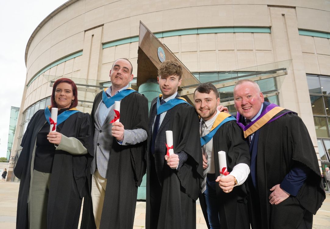 SERC Graduates posing outside the waterfront hall. 
